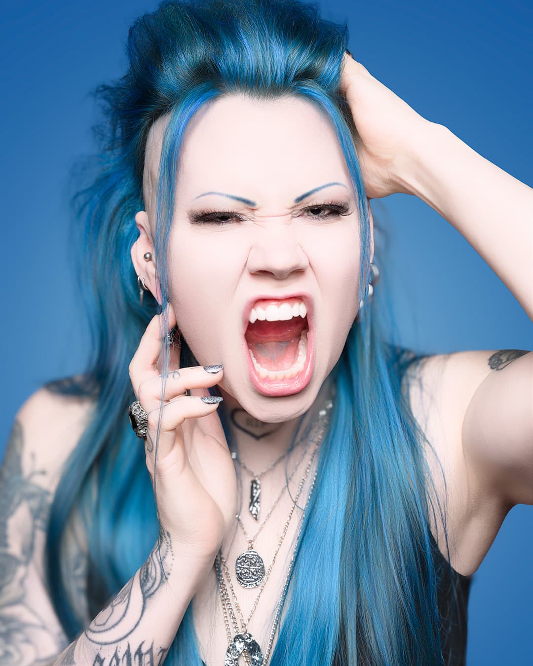 I tried to create a portrait that showcases the models unique look with her blur hair etc. 